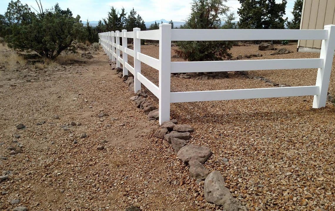 Scenic photo of vinyl ranch style fencing.