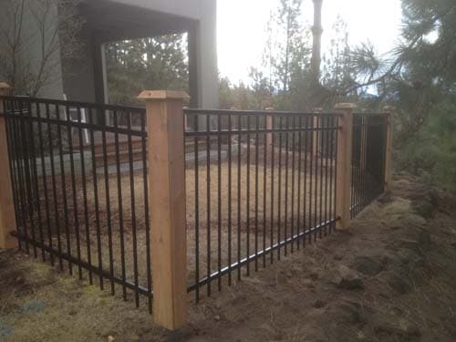 Metal fencing with cedar posts